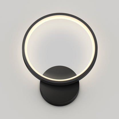 The Artika Solis modern LED indoor-outdoor wall light 5 CCT features a circular glowing ring on a round black base, displayed against a plain light gray background.