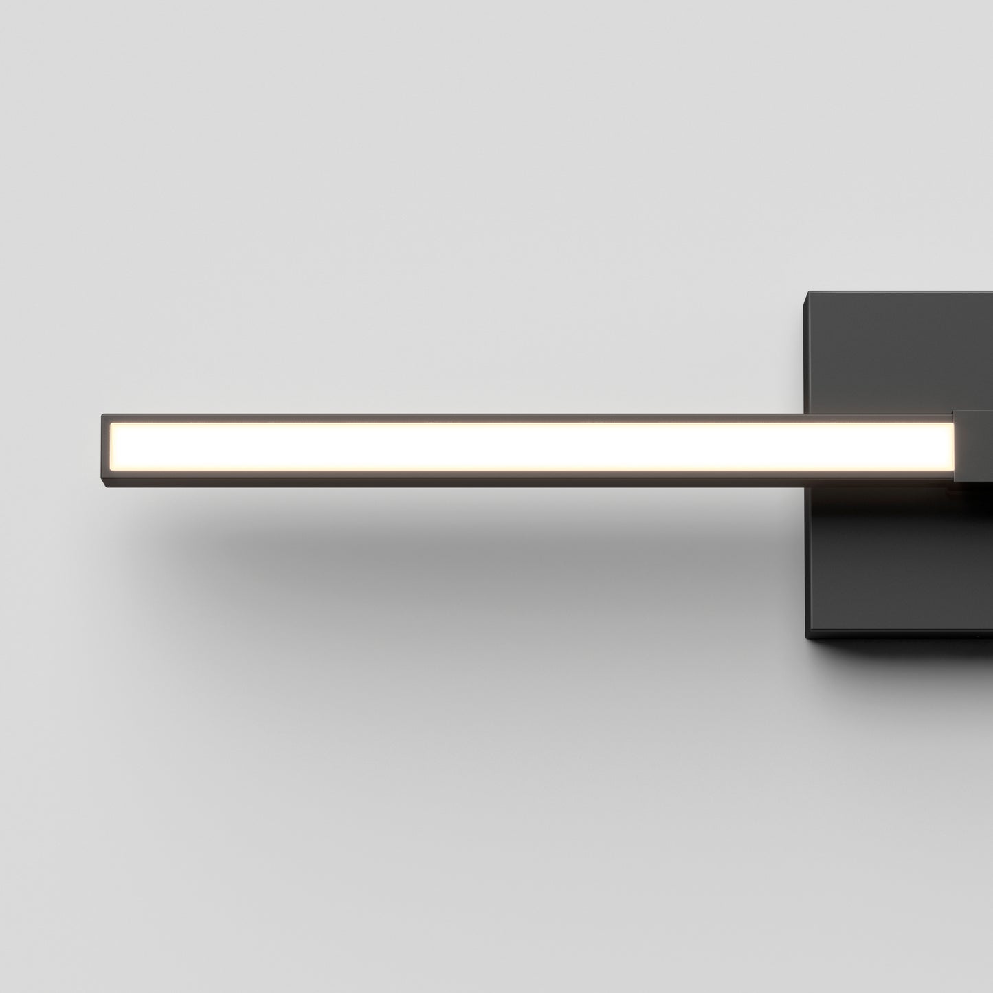 The Artika Convertible Pro 2 Wall Mounted bathroom vanity light features a minimalist black rectangular base and a sleek horizontal LED bar extending left, shown against a plain white background.