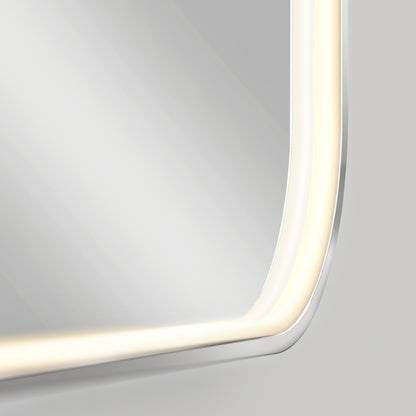 Close-up of the bottom right corner of a rectangular mirror with rounded edges, featuring a built-in LED light strip along the border, creating a soft, illuminated glow. The background is plain and light-colored.