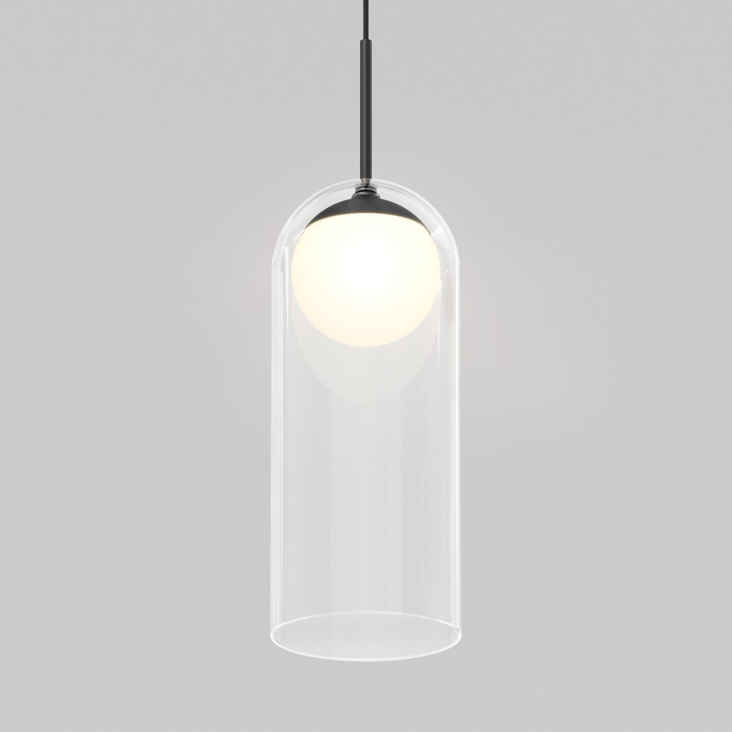 The Artika Mirah LED modern mid-century pendant light 3 CCT features a glowing white bulb in a clear cylindrical glass shade, hanging from a black cord against a plain light gray background.