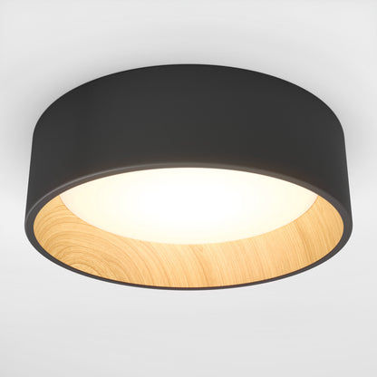 The Artika Alton LED flush mount features a dimmable design with a black outer rim, wooden inner lining, and bright white LED center—ideal for stylish, contemporary spaces.