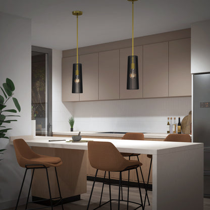 Modern kitchen featuring beige cabinets, a white island with four brown bar stools, two Artika Gatsby Mini modern mid-century pendant lights, a corner plant, stainless steel refrigerator, window, and kitchen accessories in the background.