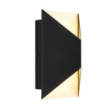A modern black wall sconce with a geometric design, emitting warm light from the top and bottom edges. The light fixture has a sleek rectangular shape with triangular cutouts.