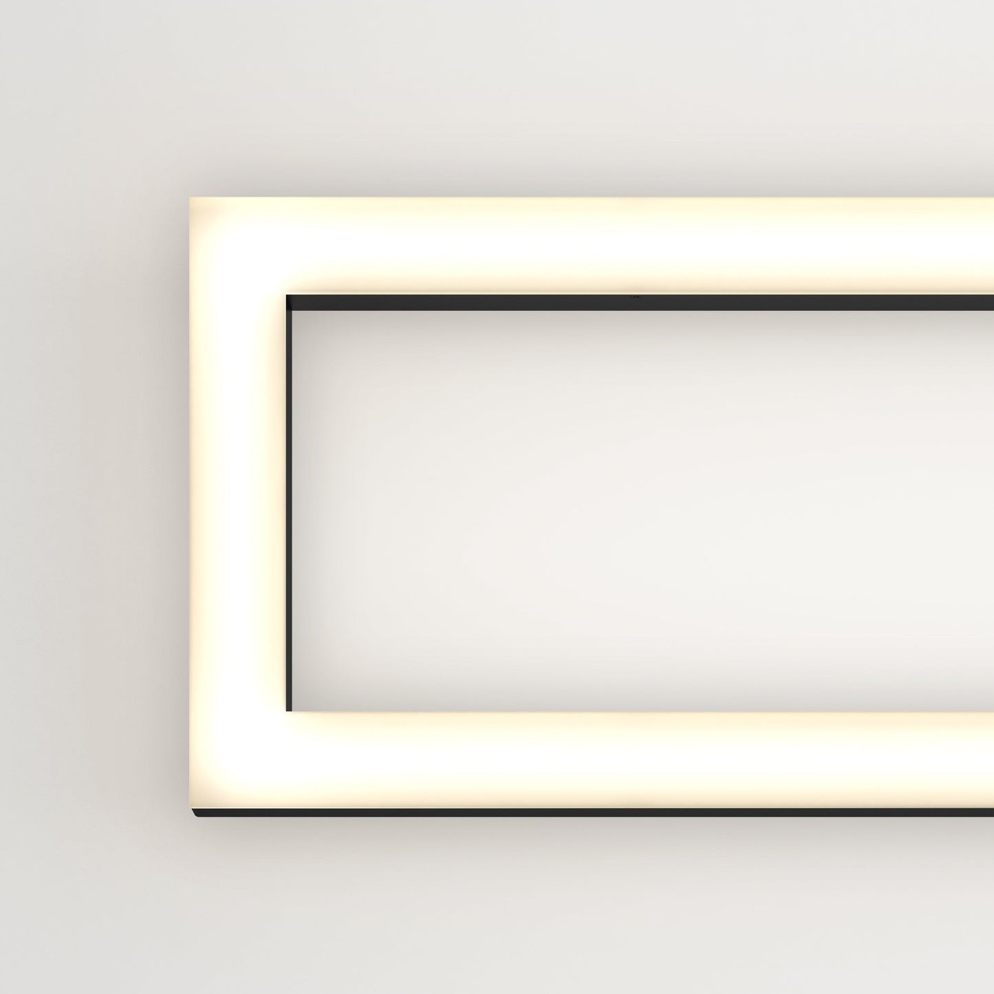 The Artika-CAN-dev Dover modern LED bathroom vanity light 5 CCT glows warmly on a white wall, with its illuminated frame visible along the left and top edges.