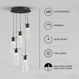 Modern pendant light fixture with five cylindrical LED lights hanging at different heights, alongside icons and text highlighting features: LED integrated, dimmable, 50,000 hours, 1200 lumens, and easy installation.