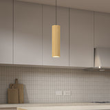 A modern kitchen with light gray cabinets, a tiled backsplash, and a beige countertop. A cylindrical wooden pendant light hangs from the ceiling. Two cutting boards rest against the wall near electrical outlets.