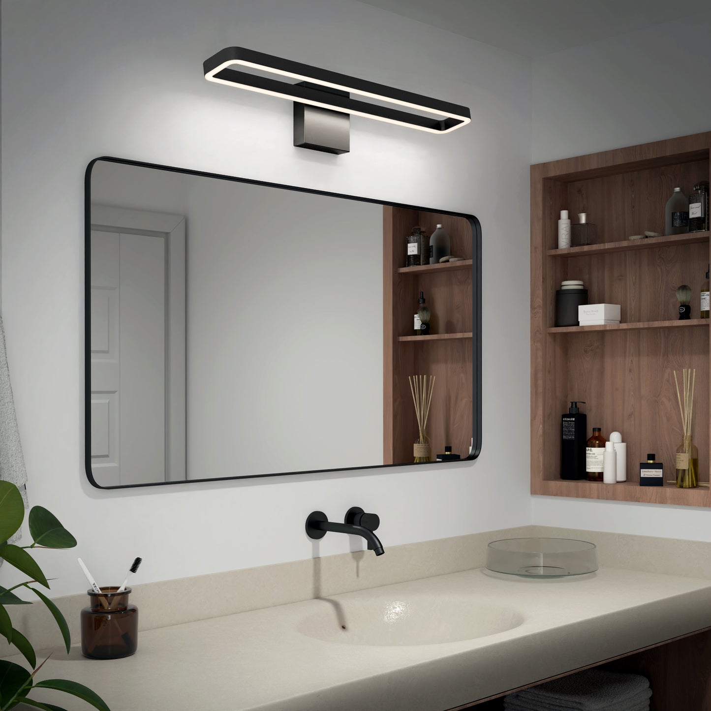 Modern bathroom with a large rectangular mirror, black wall-mounted faucet, glass vessel sink, beige countertop, wooden shelves with toiletries, and the Artika Hinge LED modern bathroom vanity light 3 CCT above the mirror.