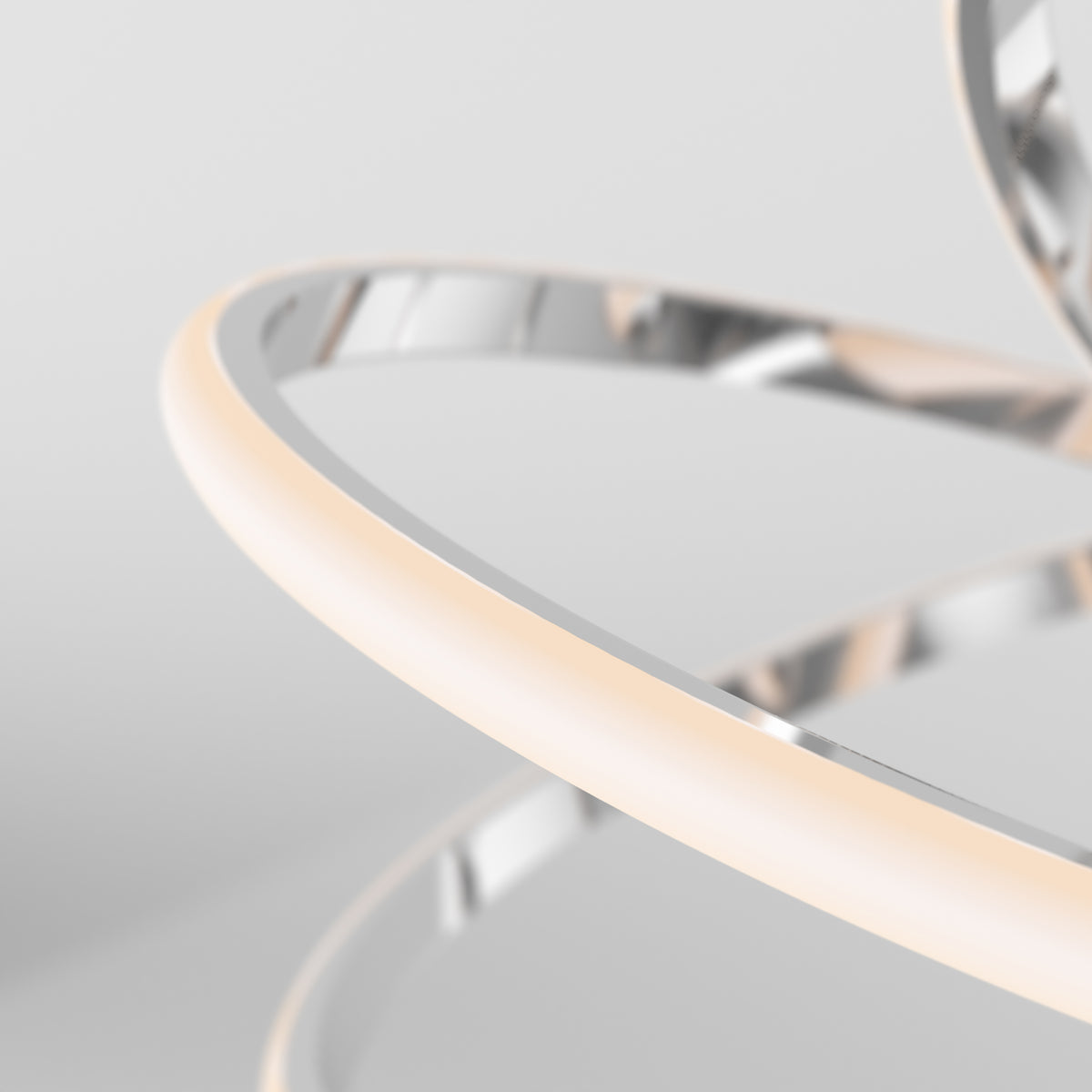 Close-up of the Artika Maelstrom modern LED pendant light 5 CCT, featuring sleek, intertwined metallic and illuminated bands against a soft light gray background for a contemporary, minimalistic aesthetic.