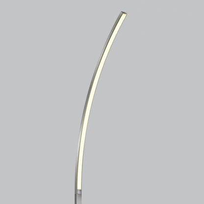 The Artika Arc LED Floor Lamp features a slim, curved design and built-in dimmable LED lighting, blending minimalist style with functionality against a plain gray background.