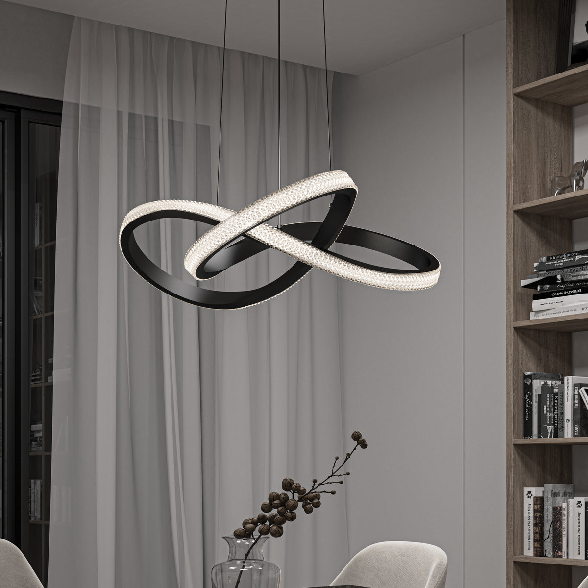 The Artika Morgan LED contemporary pendant light 5 CCT, featuring a modern black-and-white infinity shape, hangs in a stylish minimalist dining room with sheer curtains, bookshelves, and neutral-toned furniture.