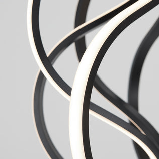 The Artika Meridian LED pendant light features curved, intertwined black and white strips in an abstract modern design, set against a plain grey background.