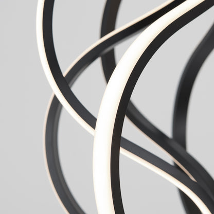 The Artika Meridian LED pendant light features curved, intertwined black and white strips in an abstract modern design, set against a plain grey background.