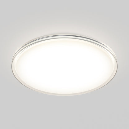 The Artika Astrid 16.5 in. LED flush mount light features 5 CCT settings and a remote, illuminating a plain light gray background with bright, even modern lighting.