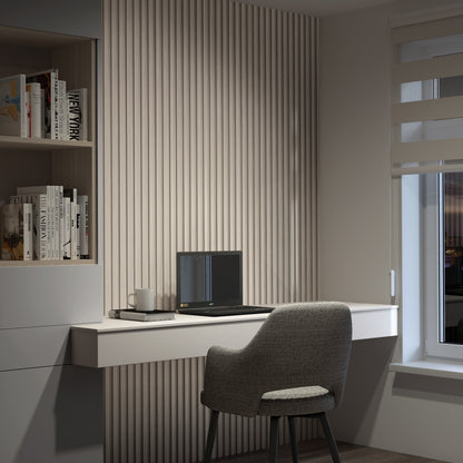 A modern home office features a gray chair at a white floating desk with a laptop, mug, and book. Artikas Panolok 30.67 ft wall panel kit (pack of 8) adds style to built-in bookshelves beside a window with striped blinds.
