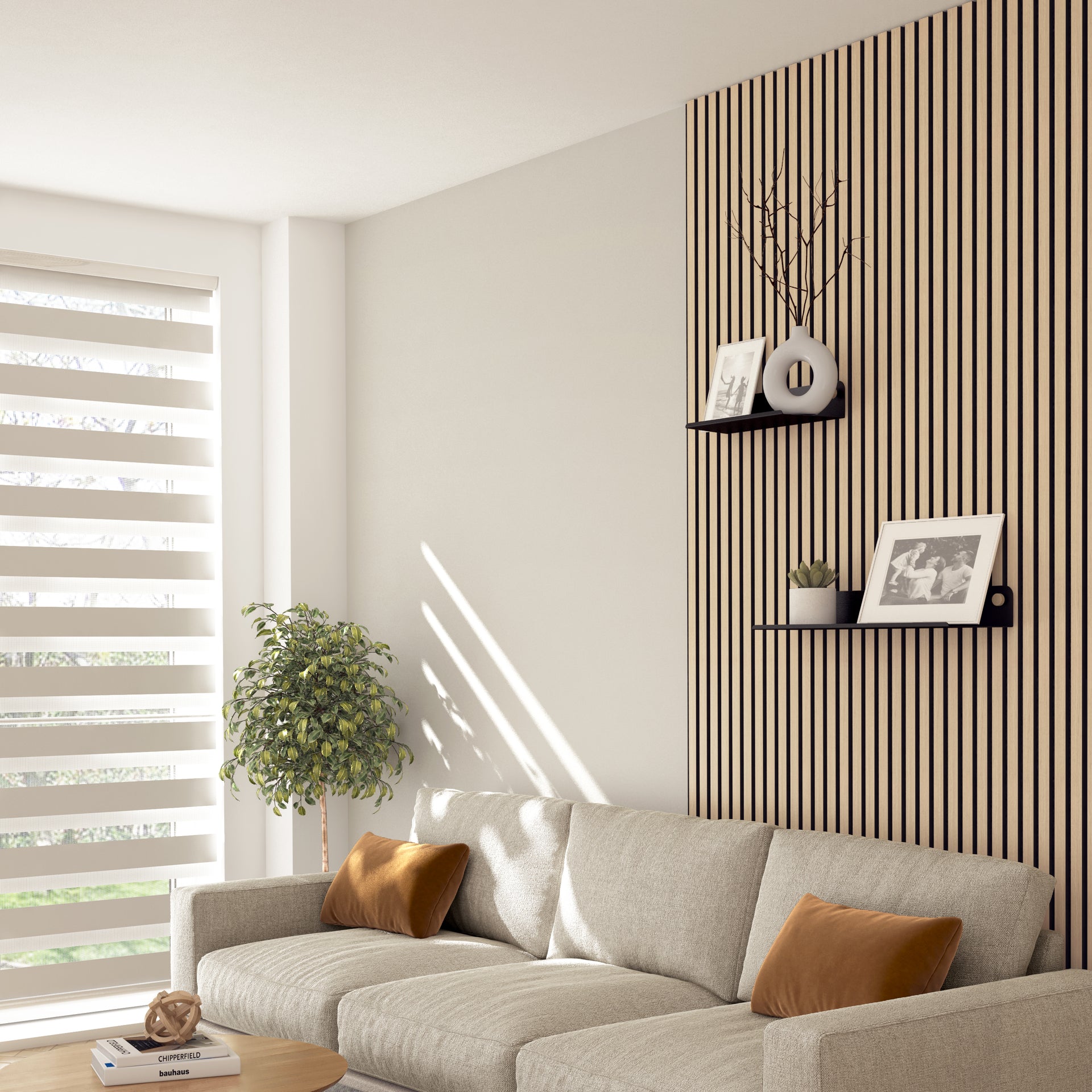 A modern living room with a beige sofa, brown cushions, a potted plant, and soundproof wall panels. Two Artika Sonokit shelves and hooks for Sonolok and Sonofold panels display framed photos. Sunlight filters through striped blinds.