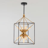 A modern pendant light fixture with exposed vintage-style bulbs arranged in a starburst design, encased in a geometric black and gold metal frame, hanging from a black ceiling mount.