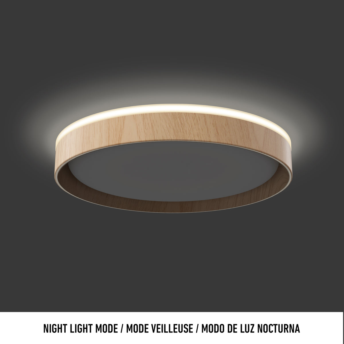 A modern, round ceiling light with a wood finish frame emits a soft, warm glow. The image background is dark gray, and a white caption below reads: Night Light Mode / Mode Veilleuse / Modo de Luz Nocturna.