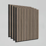 Four acoustic wall panels with vertical wooden slats in a light wood tone and black backing arranged in a staggered row against a plain light gray background.