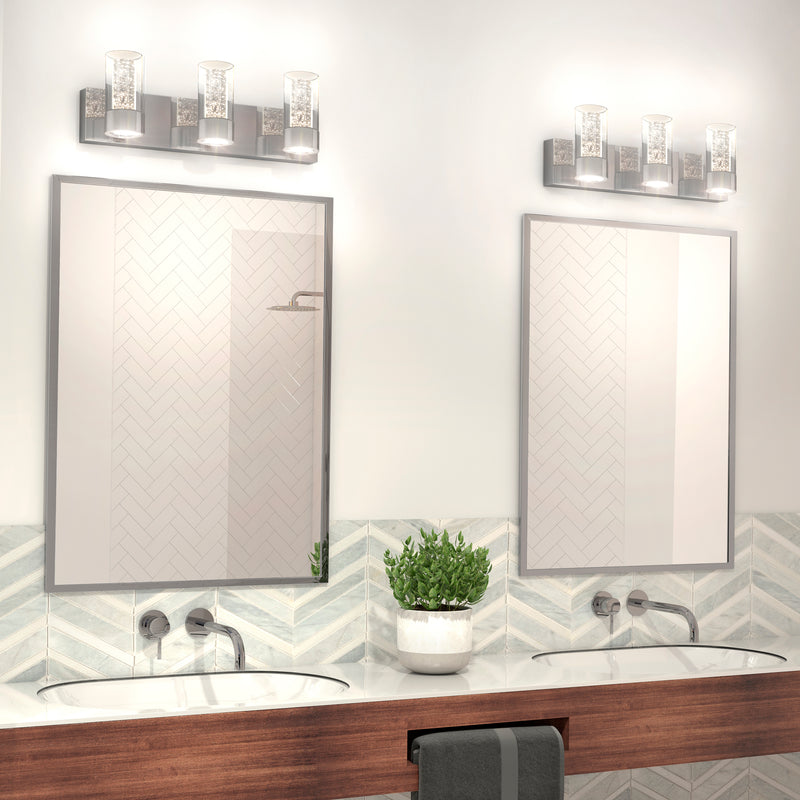 Modern bathroom with two sinks, two mirrors, a potted plant, and Artika Essence 3 LED vanity lights above each mirror.