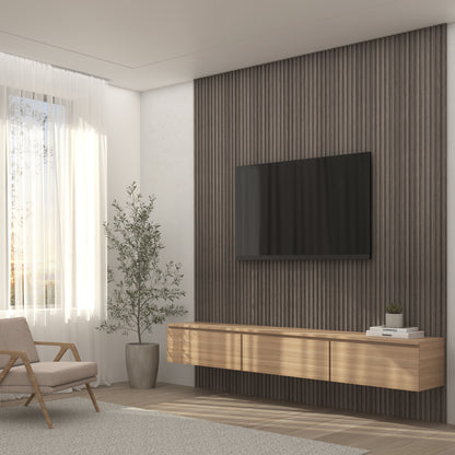 Create a minimalist living room with an Artika Panolok 30.67 ft wall panel kit as a textured accent wall, a floating wooden cabinet below a wall-mounted TV, plus touches like an armchair, potted plant, and sheer curtains for natural light.