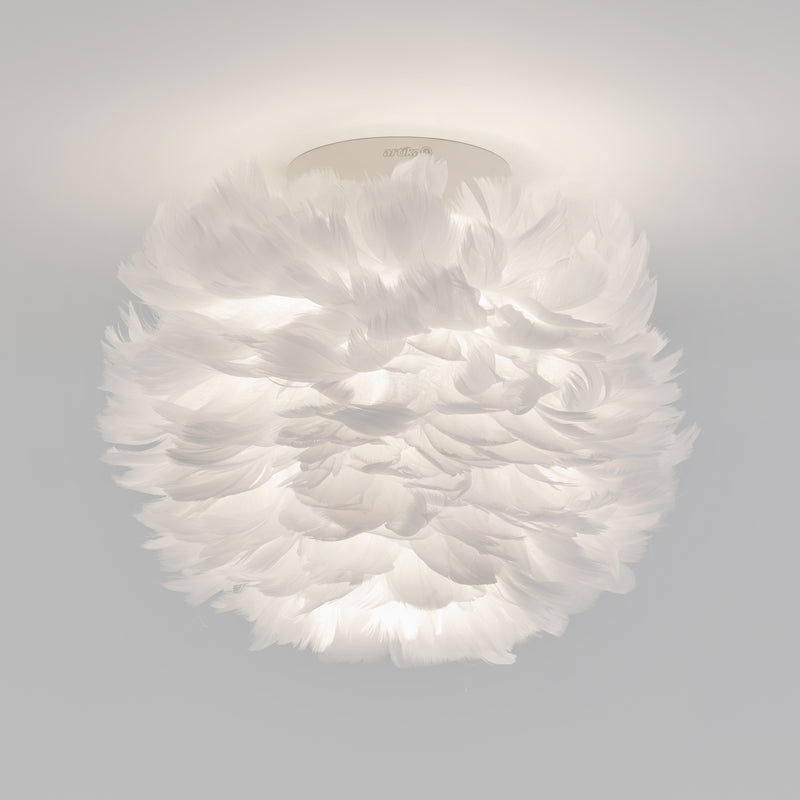 The Artika Plume LED flush mount light features soft white feathers for a fluffy, cloud-like look, making it a unique modern ceiling fixture.