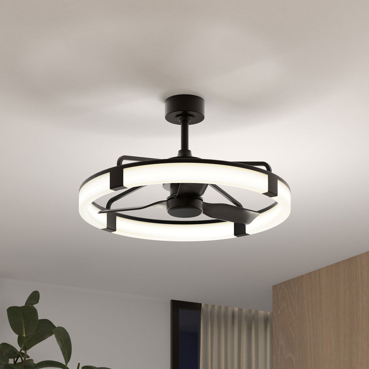 The Artika Sunnyvale 28 in. LED modern ceiling fan with remote features a circular light ring and black blades, mounted on a white ceiling. Adjustable lighting is easily controlled, with a wooden cabinet and green plant visible below.