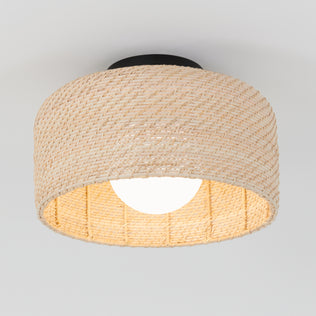 The Emiko modern LED flush mount light by Artika features a woven rattan-style beige shade, a round white bulb, and a black base, creating a contemporary look against any plain white ceiling.