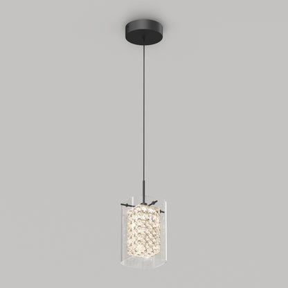 The Artika Crystal Cube 1-light LED pendant light features a black ceiling mount and cord with a cylindrical, textured glass shade that diffuses the light, shown against a plain gray background.