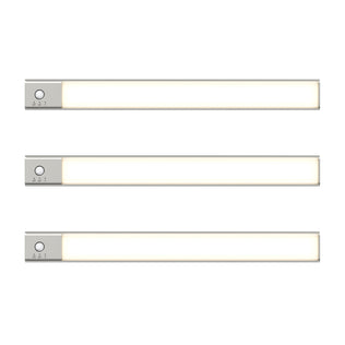 Three slim, rectangular Outline under cabinet LED light 3CCT bars by Artika, featuring silver ends and small control buttons, are arranged horizontally and evenly spaced against a white background.