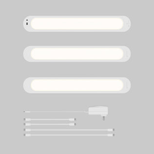 Artika Impulse Under-Cabinet LED Light RGB+CCT set with remote, adapter, and four connectors on a gray background.