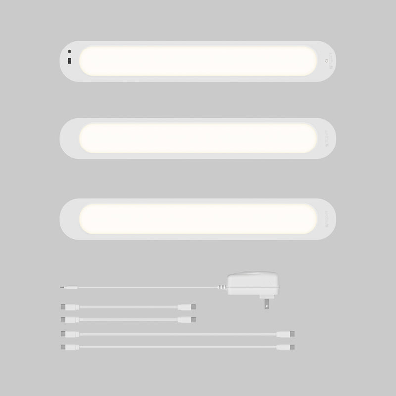 Artika Impulse Under-Cabinet LED Light RGB+CCT set with remote, adapter, and four connectors on a gray background.