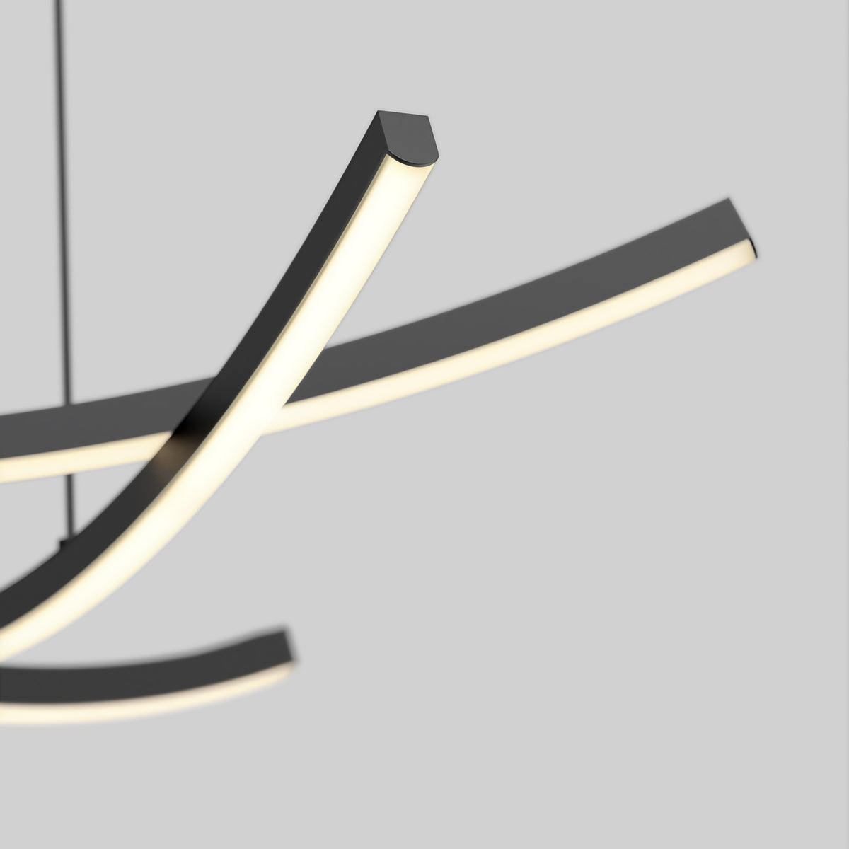 Close-up of a modern, minimalist LED pendant light fixture with curved, intersecting black and white bars against a plain light gray background.