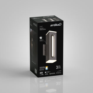 A black rectangular Artika box for the Linea Square LED indoor-outdoor wall light 3 CCT shows the modern vertical lamp image, product info, icons, and branding on a plain gray background.