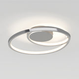 A modern ceiling light fixture featuring two intertwined, illuminated metal rings with a sleek, minimalist design, mounted on a plain white ceiling.