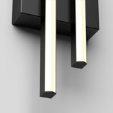 A close-up view of a modern wall-mounted light fixture with two vertical rectangular light bars attached to a black base, set against a plain white background.