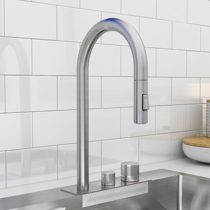 The Artika Neoflow single bowl stainless steel sink features a modern faucet with a tall curved spout and two textured knobs, installed in front of a white subway tile backsplash.