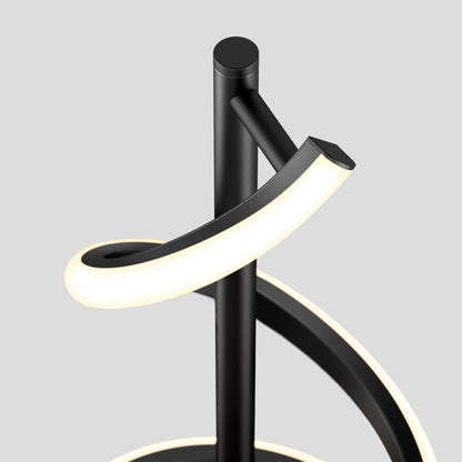 The Artika Coda modern LED floor lamp 5CCT features curved black light strips spiraling around a central pole, shown against a plain light gray background.