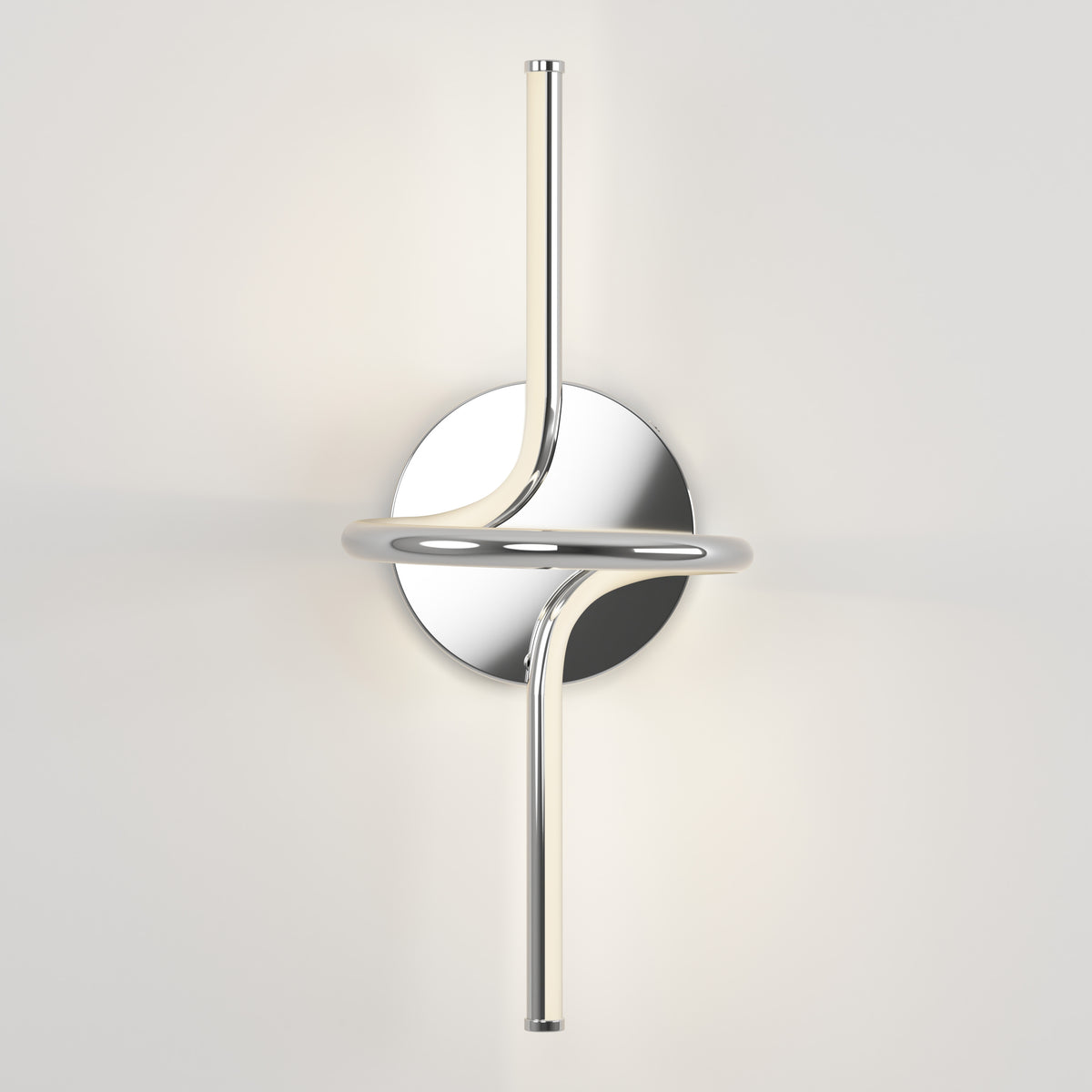 A modern wall sconce with two sleek, curved chrome rods intersecting through a circular base, emitting soft white light against a plain white wall.