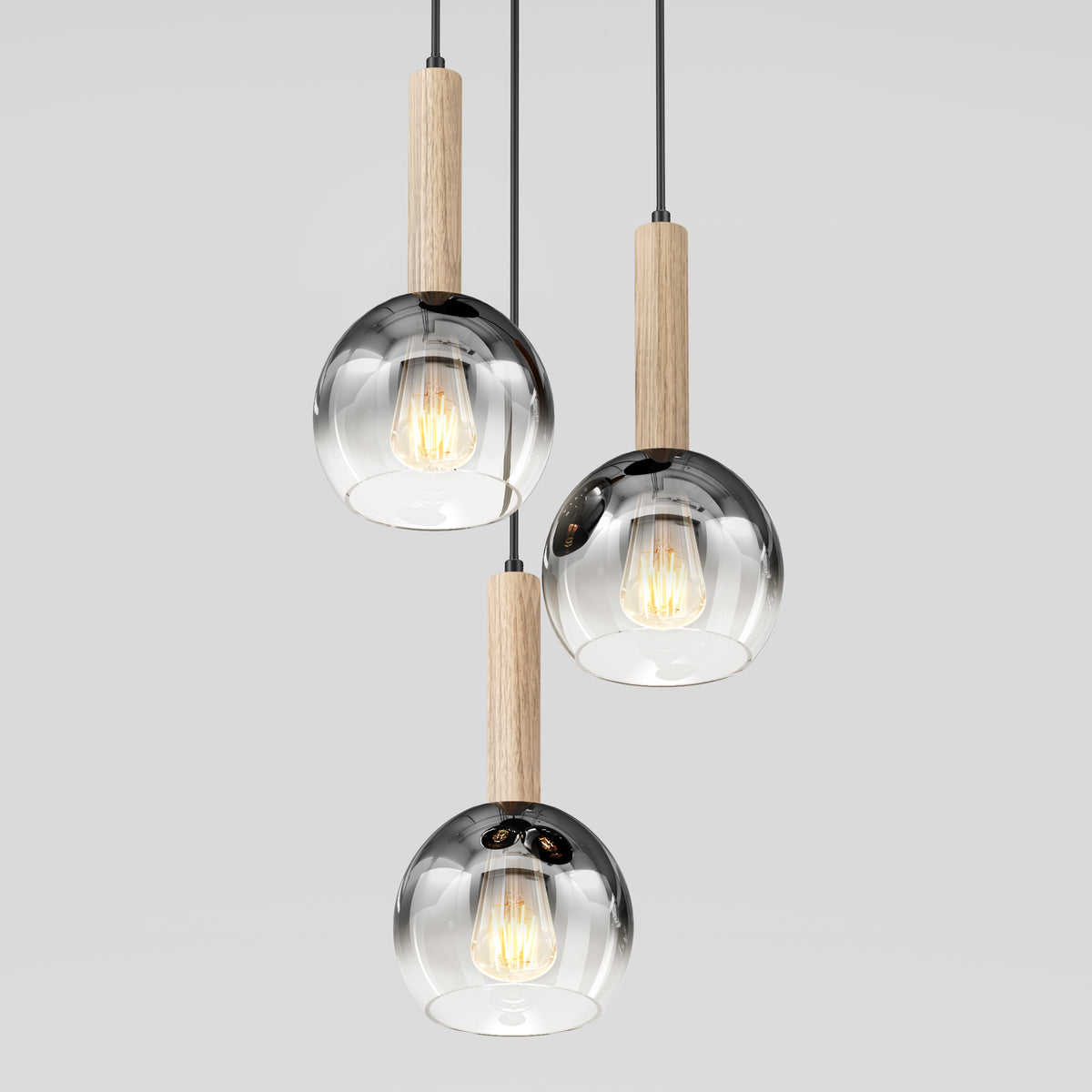 The Ardel Spiral 3-Light Pendant by Artika features clear glass globes, wooden accents, and hangs from black cords against a plain light background; bulbs not included.