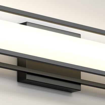 The Artika Venicia LED Wall Sconce features a modern design with a rectangular black base and long frosted glass shade, casting a soft, even glow against light-colored walls.