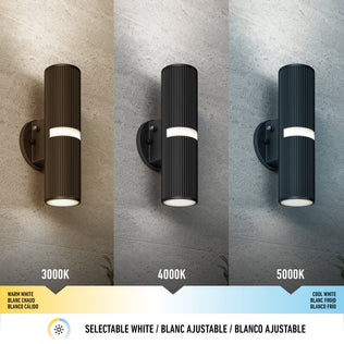 Three Artika Groove LED indoor-outdoor wall lights are mounted on a textured wall, each displaying a distinct white tone—warm (3000K), neutral (4000K), and cool (5000K)—with a color temperature scale shown beneath.