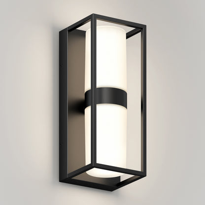 The Artika Sherman modern LED indoor-outdoor wall light 5 CCT features a rectangular black metal frame and cylindrical white frosted glass shade, shown mounted on a light gray wall.