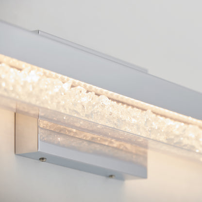 Close-up of Artika Riviera 27-in LED Vanity Light Bar, wall-mounted, featuring a textured crystal-like glowing strip.