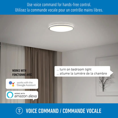 An Artika Macy 15 in. LED modern flush mount light glows in a sleek room. Text notes English and French voice commands plus Google Assistant and Amazon Alexa compatibility for hands-free control via WiFi.