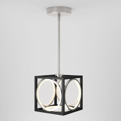 The Artika Astoria LED modern pendant light features a silver ceiling mount, straight rod, and black cube frame with suspended circular LED lights, highlighting its geometric style against a plain white background.