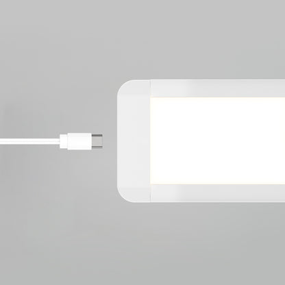A white USB-C cable is positioned near the port of the Artika Maestro under cabinet LED light 3CCT, a rectangular white device, on a light gray background.