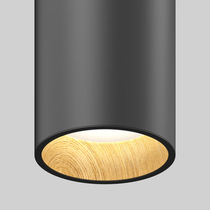 The Alton mini LED pendant light 5 CCT by Artika features a cylindrical design with a matte black exterior and wood-textured inner rim, casting a soft, warm glow against a plain light gray background.