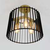 A modern ceiling light fixture with three exposed bulbs, enclosed in a cylindrical black metal cage with vertical bars and a gold-toned central structure, against a plain white background.