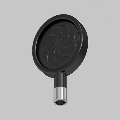 A 3D-rendered image of a circular, black Artika Sonokit part with a swirl pattern and short metallic attachment, designed for quick installation with Sonokit shelves and hooks for Sonolok and Sonofold wall panels, set on a plain gray background.