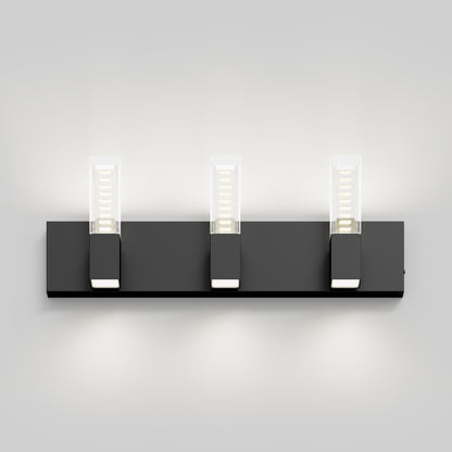 The Artika Hologram LED modern bathroom vanity light 5 CCT features three rectangular LED fixtures with transparent covers on a black base, adding a sleek look to any light gray wall.